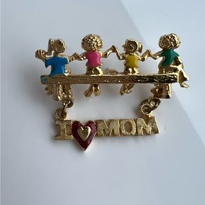 Brooch Pin Gold Tone
- Children With Dangling Sign “I Love Mom”